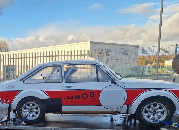 Rally-prepared Mk2 Ford Escort on a transporter outside the BAR Propshafts workshop